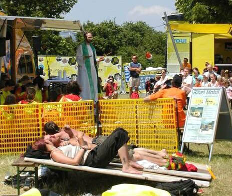 People lounging during an outdoor trailer picnic mass